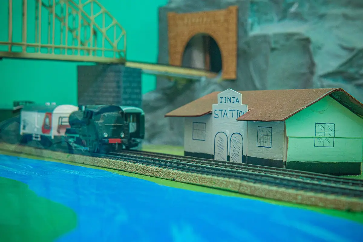 Scale-model railway exhibit with a sign for Jinja Station